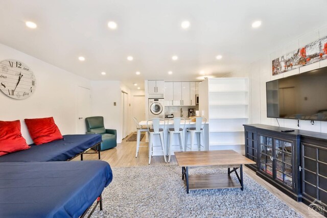 59 Scribner Hollow Rd # B-2, Hunter, NY 12442 - living room featuring light wood finished floors, recessed lighting, and estacked washer and dryer