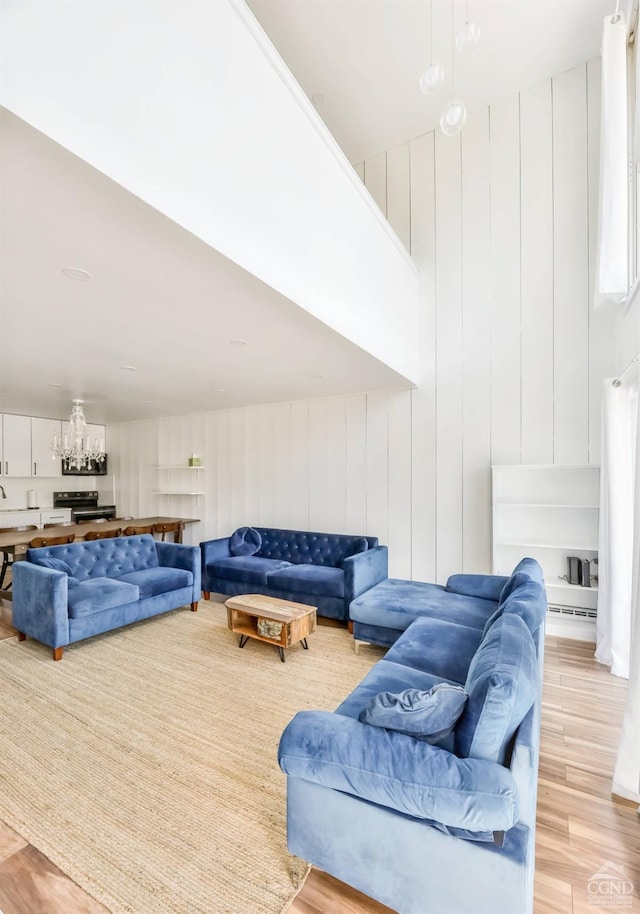 59 Scribner Hollow Rd # B-2, Hunter, NY 12442 - living area featuring light wood-type flooring and a chandelier