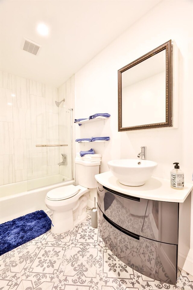 59 Scribner Hollow Rd # B-2, Hunter, NY 12442 - full bath featuring toilet, shower / tub combination, vanity, and tile patterned flooring