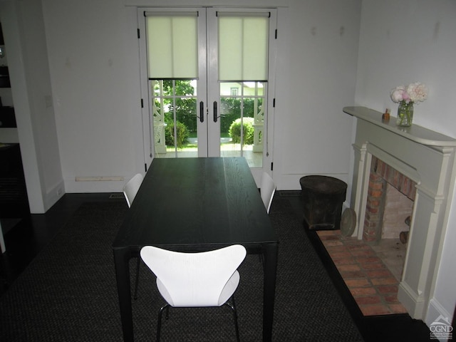 1001 State Route 9j, Stuyvesant, NY 12173 - dining space with french doors, baseboards, and a fireplace