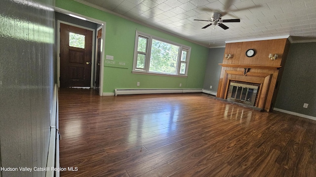 183 S St, Windham, NY 12496 - unfurnished living room with ornamental molding, ceiling fan, a baseboard heating unit, dark wood-type flooring, and a glass covered fireplace