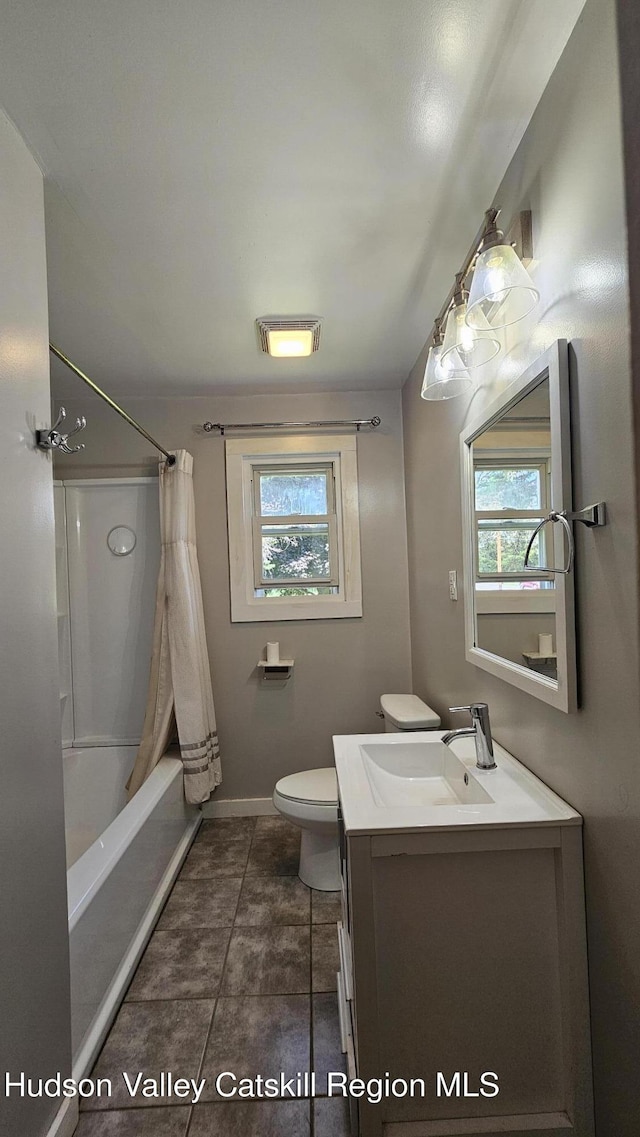 183 S St, Windham, NY 12496 - full bath with vanity, plenty of natural light, shower / bath combo with shower curtain, and tile patterned flooring
