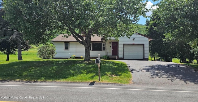 183 S St, Windham, NY 12496 - view of front of house featuring asphalt driveway, a front yard, and an attached garage