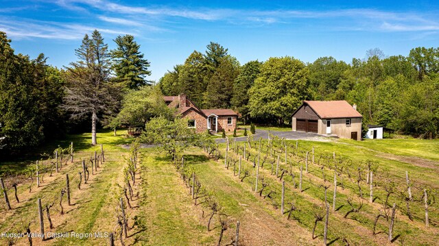 273 Round Top Rd, Germantown, NY 12526 - view of yard featuring an outbuilding, a detached garage, fence, a wooded view, and a rural view