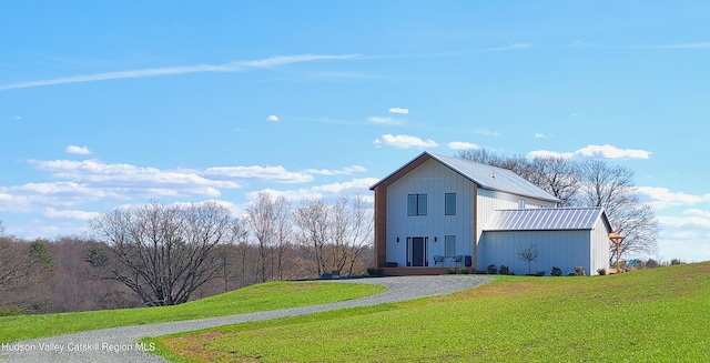 exterior space with a yard and an outbuilding