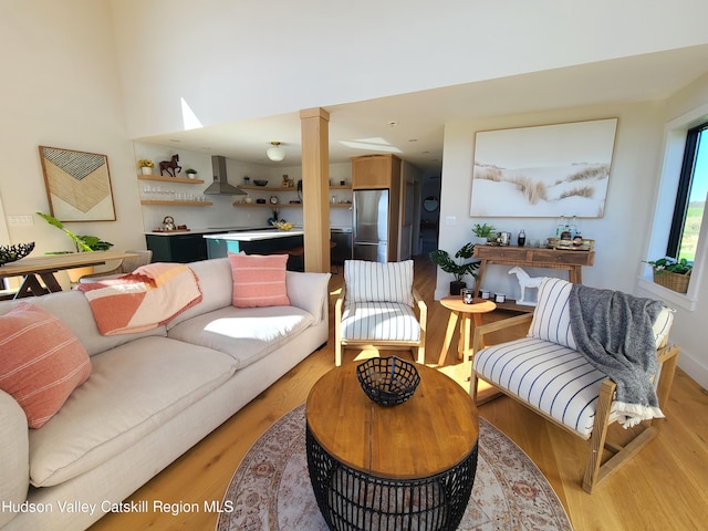 living room with light hardwood / wood-style flooring