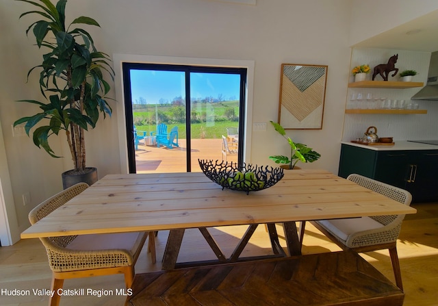 dining space with light parquet flooring