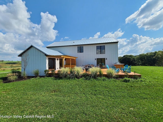 back of house featuring an outdoor living space, a yard, and a deck