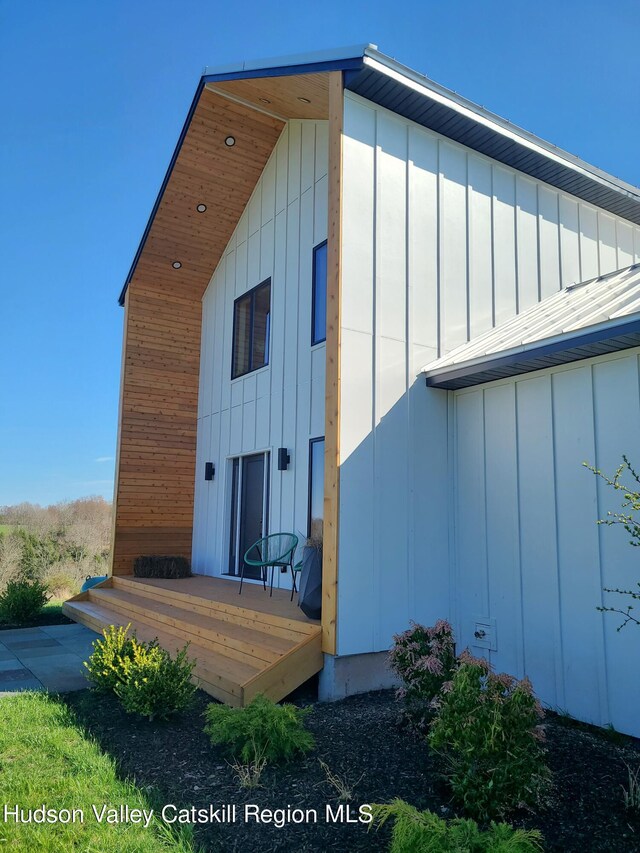 back of house featuring a deck