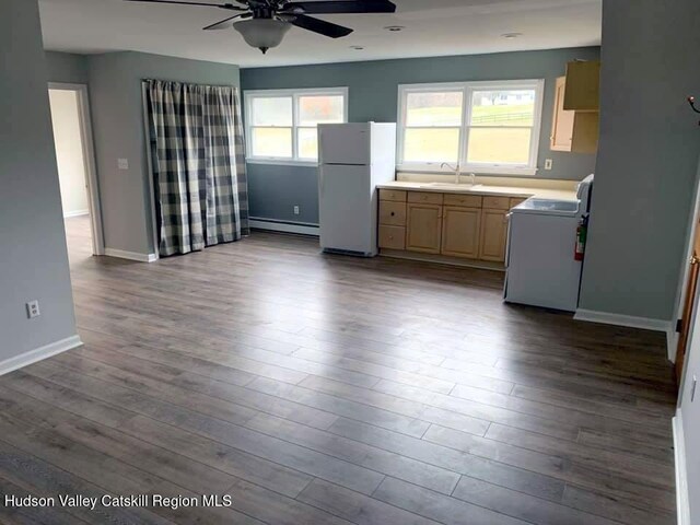 kitchen with ceiling fan, sink, white appliances, and light wood-type flooring