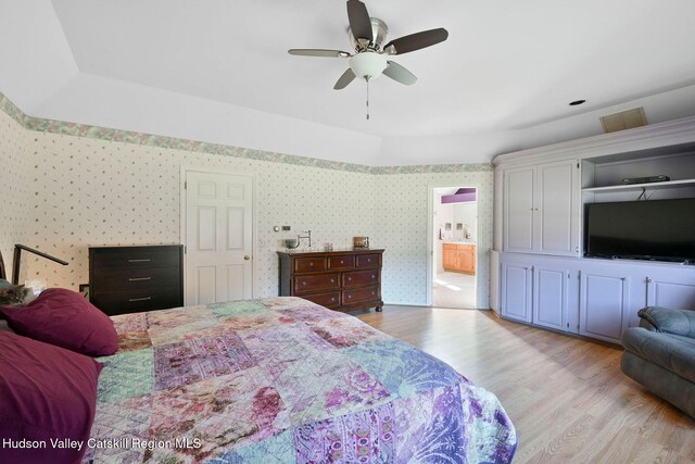 bedroom featuring light hardwood / wood-style floors and ceiling fan