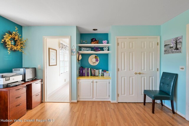 hall featuring light tile patterned floors