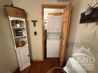 274 Brooksburgh Rd Unit 10, Windham, NY 12496 - laundry room with stacked washer and clothes dryer, wood finished floors, and baseboards