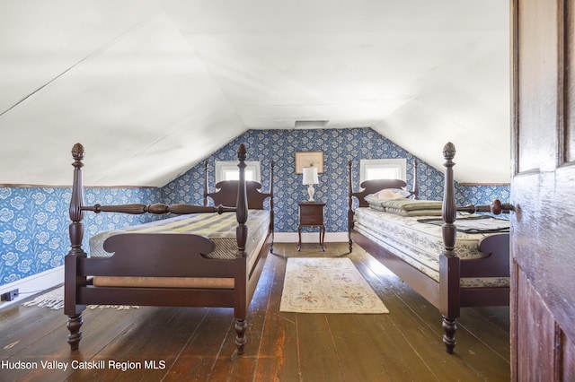 55 Church Ave, Germantown, NY 12526 - bedroom with wallpapered walls, wood-type flooring, vaulted ceiling, and baseboards