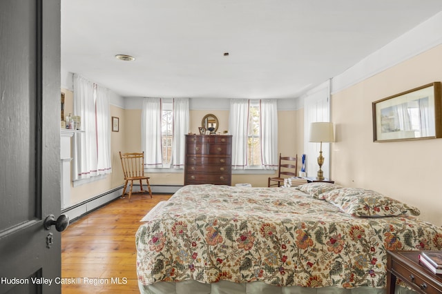 55 Church Ave, Germantown, NY 12526 - bedroom featuring light wood-style floors and a baseboard radiator