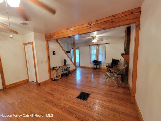 2457 State Route 82, Ancram, NY 12502 - living area featuring ceiling fan, wood finished floors, and baseboards