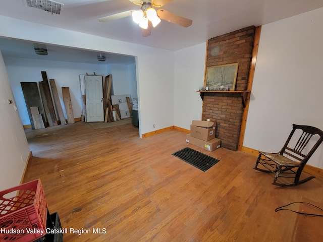 2457 State Route 82, Ancram, NY 12502 - living room featuring wood finished floors, ceiling fan, and baseboards