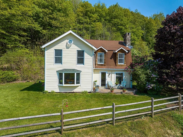 view of front of home with a front lawn