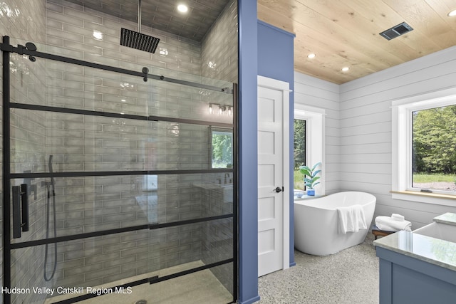 1248 Albany Post Rd, Gardiner, NY 12525 - bathroom with speckle patterned floor, a shower stall, a soaking tub, vanity, and recessed lighting