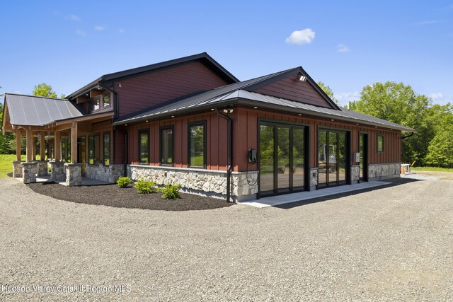 1248 Albany Post Rd, Gardiner, NY 12525 - view of side of home featuring stone siding and metal roof