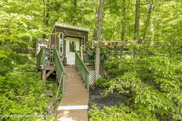 exterior space featuring a wooden deck and stairway