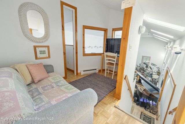 living area featuring a baseboard heating unit