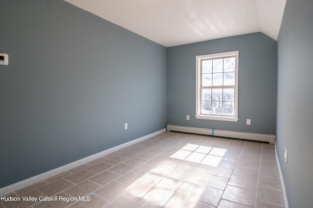 7180 Rte 209, Wawarsing, NY 12489 - tiled empty room featuring a baseboard heating unit and vaulted ceiling
