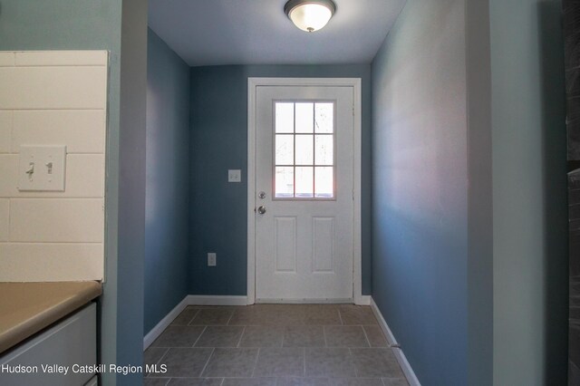 entryway with tile patterned floors