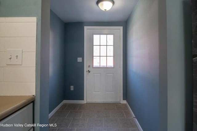 7180 Rte 209, Wawarsing, NY 12489 - doorway to outside with baseboards and tile patterned floors