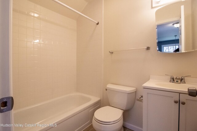 full bathroom featuring bathtub / shower combination, vanity, and toilet