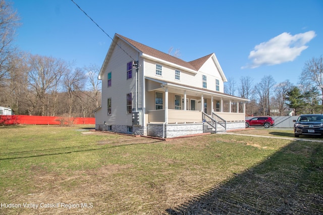 view of front of home with a porch and a front yard