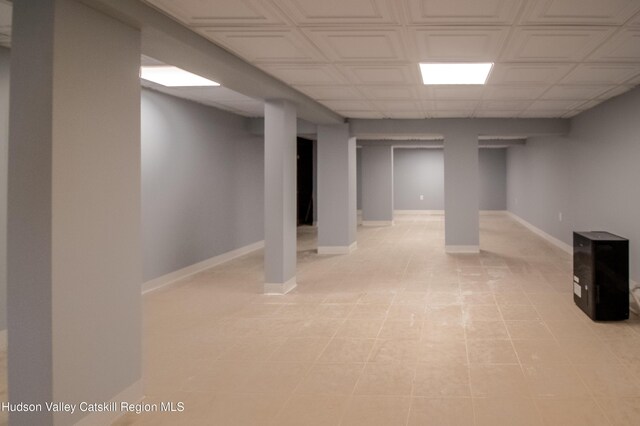 basement featuring light tile patterned floors