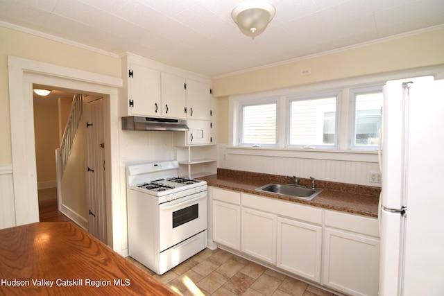 kitchen with white cabinetry, sink, ornamental molding, and white appliances