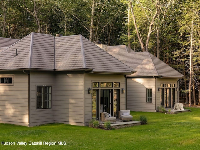 245 Brown Rd, Olivebridge, NY 12461 - back of property with a lawn, a chimney, and a patio area