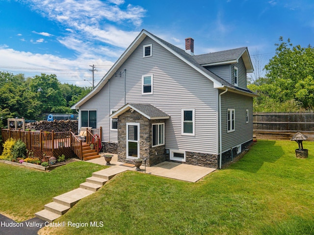2-6 Old Firehouse Rd, Plattekill, NY 12568 - back of property featuring a deck, a chimney, a shingled roof, and a patio