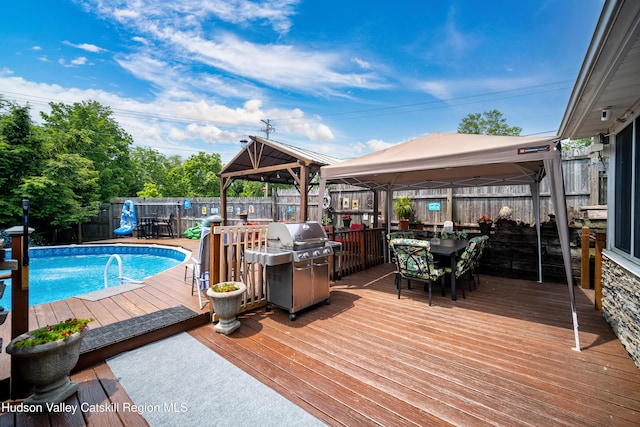 2-6 Old Firehouse Rd, Plattekill, NY 12568 - deck featuring a gazebo, grilling area, outdoor dining area, and a fenced backyard