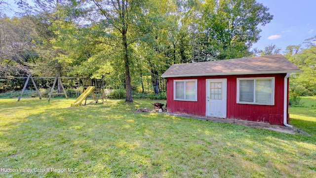13 Birk St, Acra, NY 12405 - view of grassy yard with a playground and an outbuilding