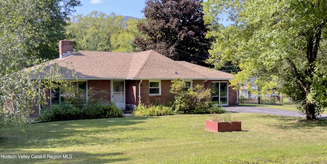 13 Birk St, Acra, NY 12405 - single story home with a front yard, a chimney, brick siding, asphalt driveway, and roof with shingles