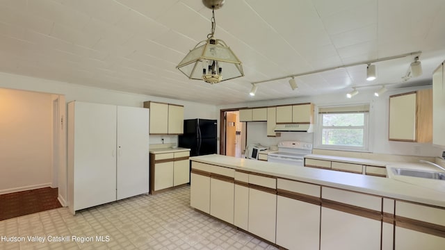 13 Birk St, Acra, NY 12405 - kitchen featuring electric range, rail lighting, freestanding refrigerator, range hood, and light countertops