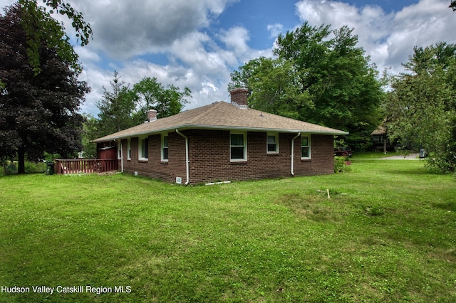 13 Birk St, Acra, NY 12405 - view of side of property with a chimney, brick siding, a yard, and a wooden deck
