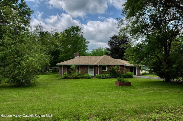 13 Birk St, Acra, NY 12405 - ranch-style home with a front lawn, a chimney, and brick siding