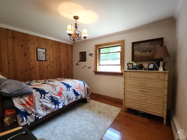 159 Toles Hollow Rd, Conesville, NY 12076 - bedroom with ornamental molding, wood finished floors, a chandelier, a baseboard heating unit, and wooden walls