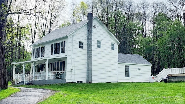 287 Shady Glen Rd, East Durham, NY 12423 - view of side of home featuring a porch, a chimney, a yard, and crawl space