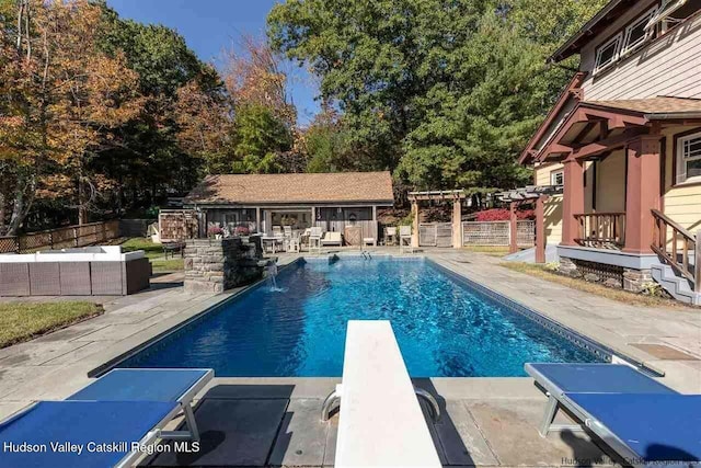 view of swimming pool with a patio, outdoor lounge area, a pergola, fence, and a fenced in pool