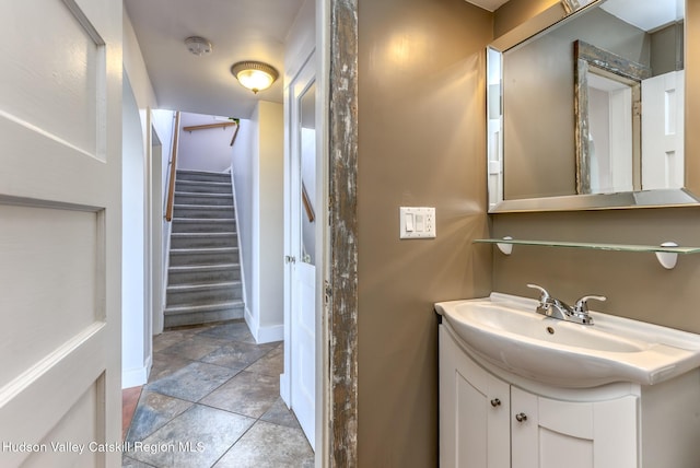 bathroom with vanity and baseboards