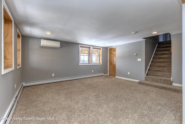 below grade area featuring carpet floors, stairs, baseboard heating, and an AC wall unit