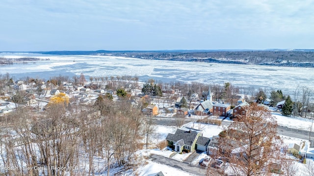 snowy aerial view with a residential view