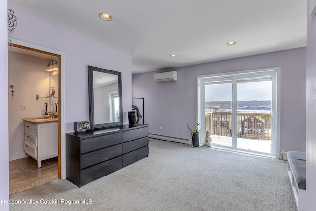 bedroom with access to exterior, recessed lighting, light colored carpet, baseboard heating, and an AC wall unit