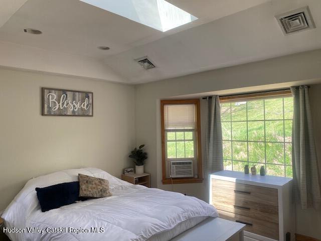 87 Dock St, Saugerties, NY 12477 - bedroom featuring a skylight, vaulted ceiling, and cooling unit