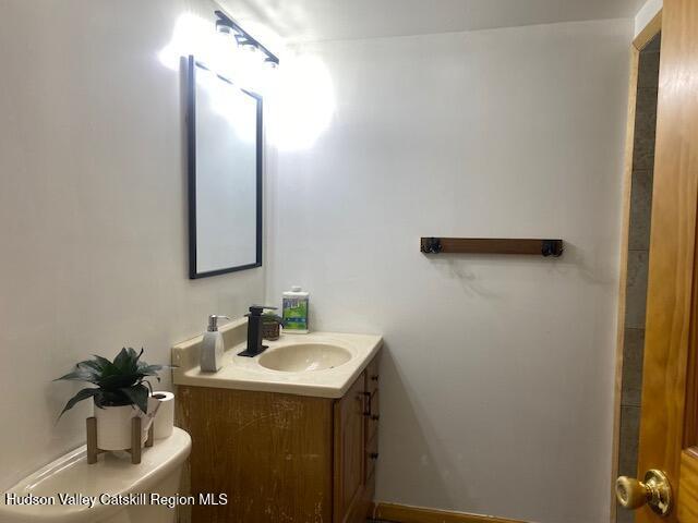 87 Dock St, Saugerties, NY 12477 - bathroom with vanity and toilet